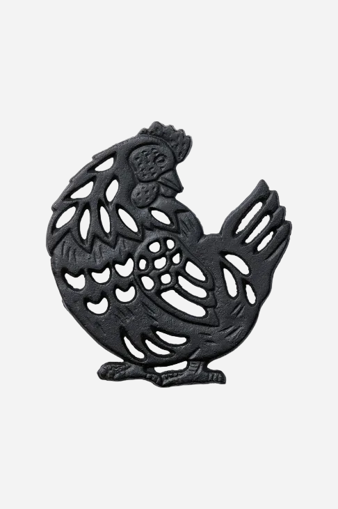 Svart grytunderlägg i gjutjärn format som en höna